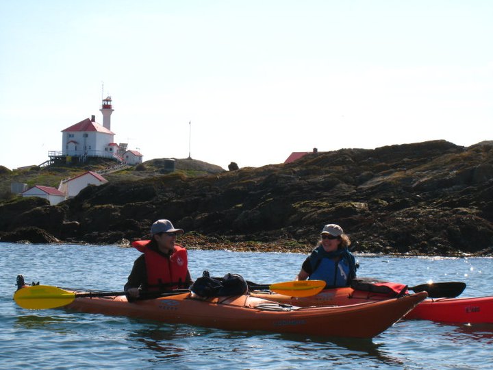 Two kayaker near Trial Island with the lighthouse in the background